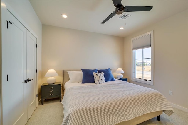 bedroom with light carpet and ceiling fan