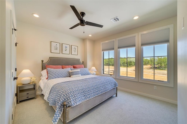 carpeted bedroom with ceiling fan