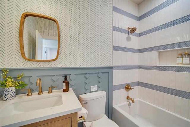 full bathroom featuring tub / shower combination, toilet, and vanity