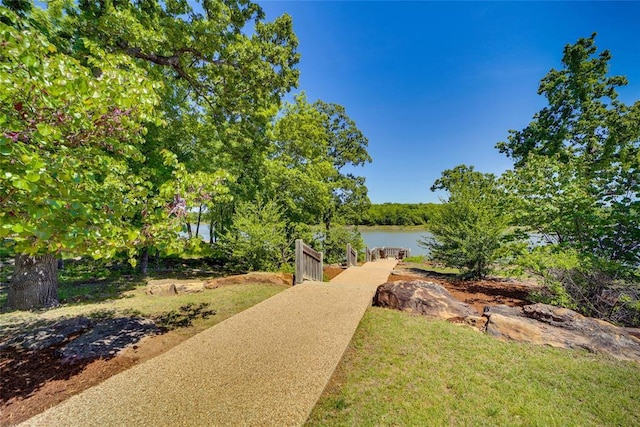 view of home's community with a water view