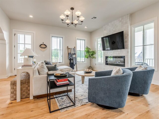 56 Center Ln, Carlton Landing, OK 2023 - living room with a chandelier, plenty of natural light, light wood finished floors, and recessed lighting