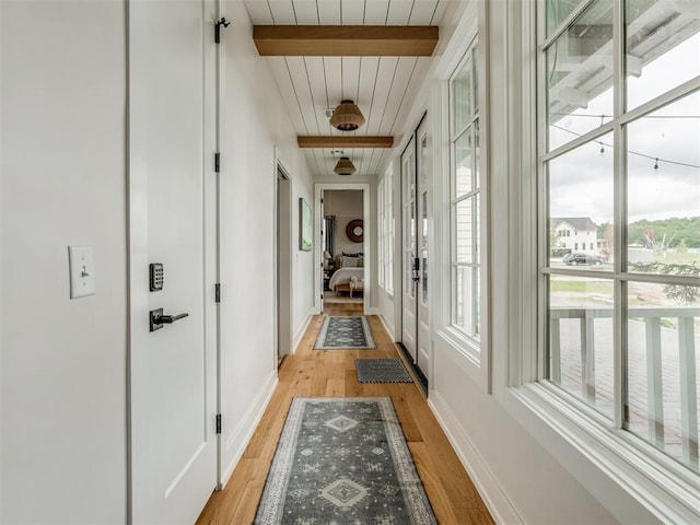 56 Center Ln, Carlton Landing, OK 2023 - hallway with beamed ceiling and light wood-type flooring