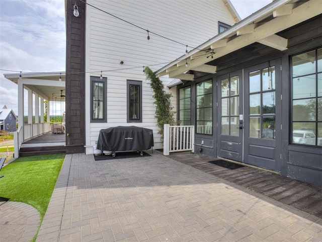 56 Center Ln, Carlton Landing, OK 2023 - view of patio featuring french doors, a wooden deck, and a grill