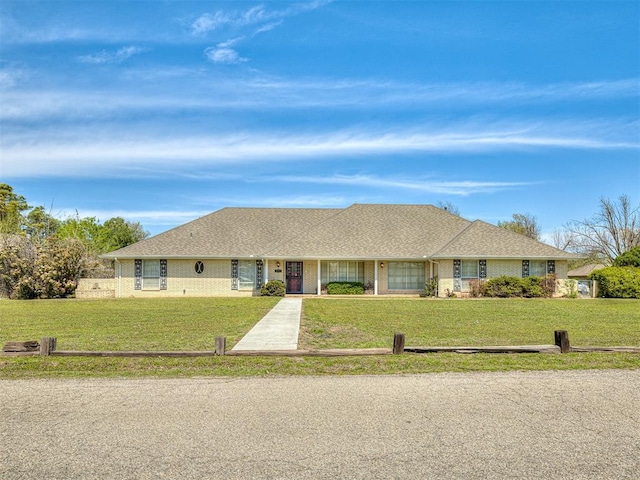 ranch-style home with a front yard