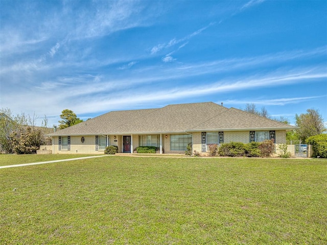 ranch-style house featuring a front lawn