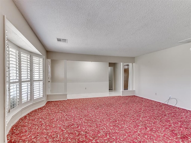 spare room featuring a textured ceiling