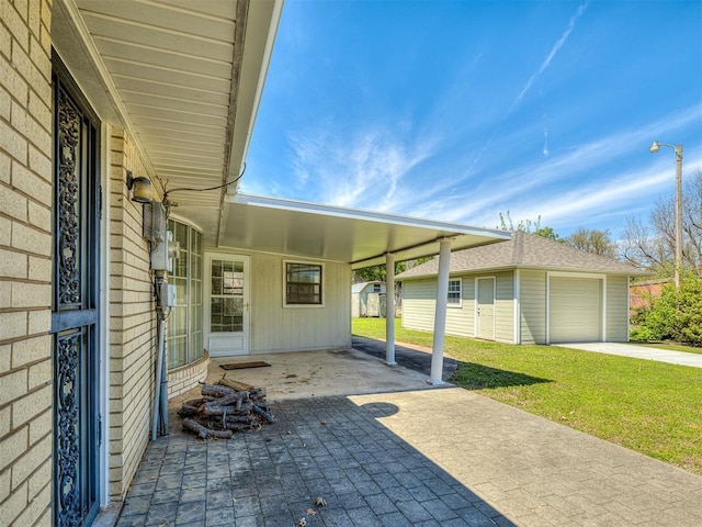 view of patio with a garage, an outdoor structure, and a carport