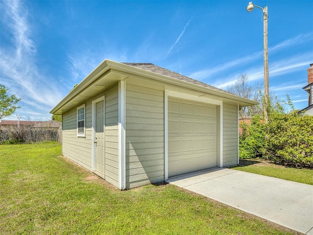 garage featuring a yard