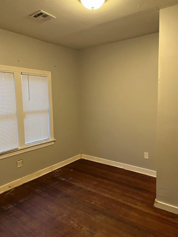 empty room featuring dark hardwood / wood-style floors