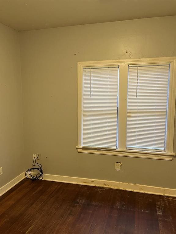 spare room with hardwood / wood-style flooring