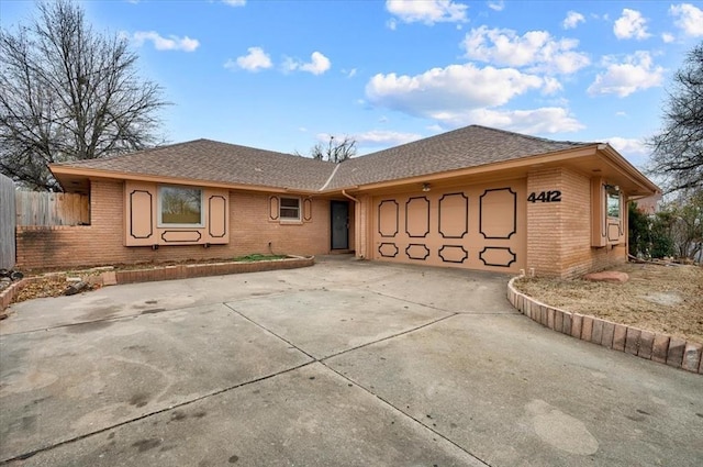 ranch-style home featuring a garage