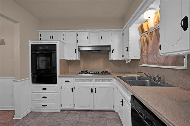 kitchen featuring white cabinets, dishwasher, and sink