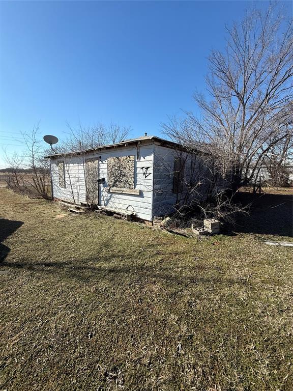 view of home's exterior with a lawn