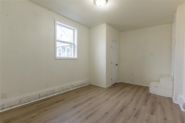 unfurnished room featuring light wood-type flooring