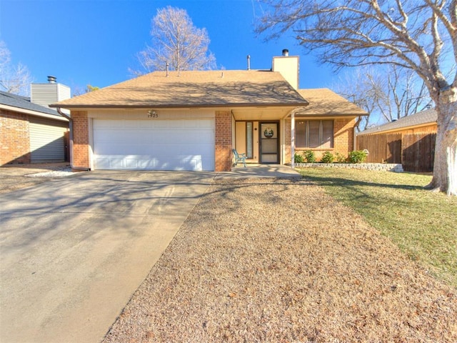 single story home featuring a front yard and a garage