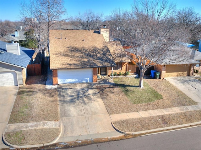 view of front of home featuring a garage and a front yard