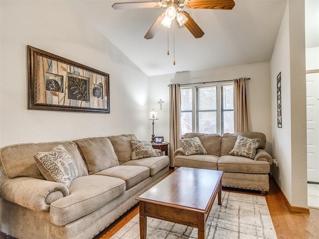 living room with vaulted ceiling, ceiling fan, and light hardwood / wood-style floors