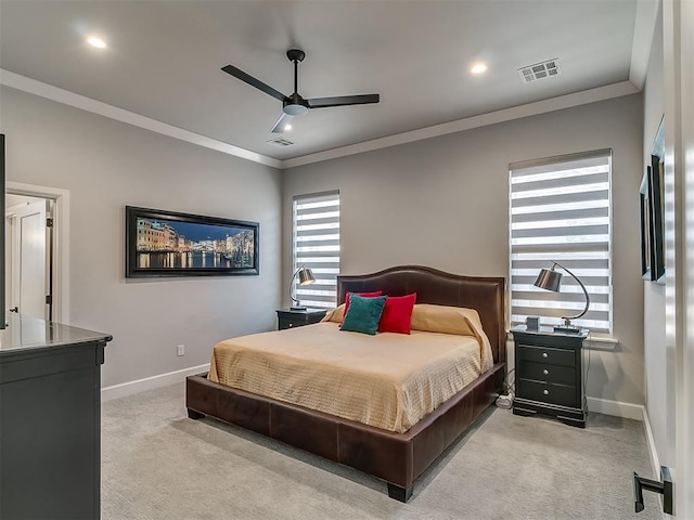 carpeted bedroom featuring crown molding and ceiling fan