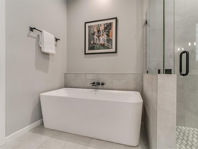 bathroom featuring tile patterned floors and plus walk in shower