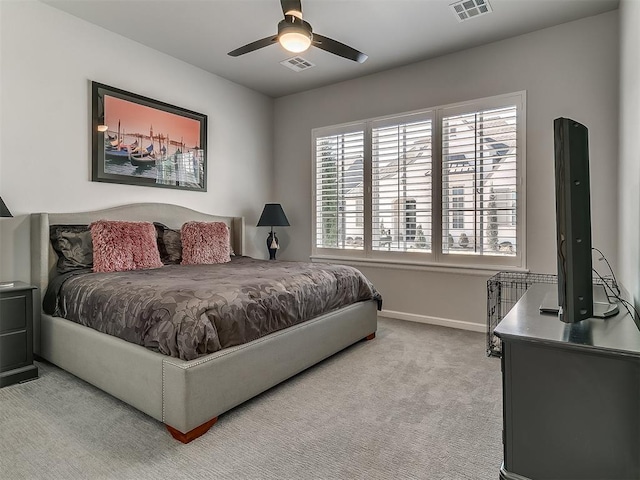 bedroom featuring light colored carpet and ceiling fan