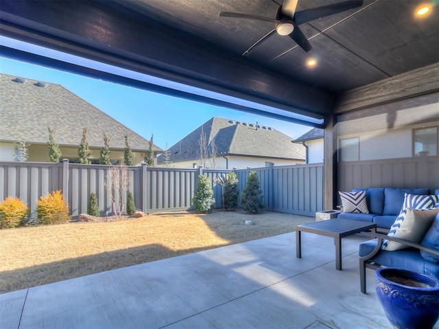 view of patio / terrace with ceiling fan and an outdoor living space