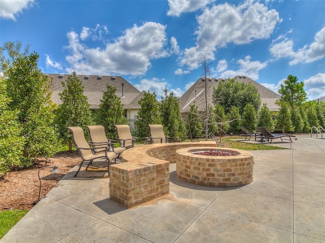 view of patio / terrace with an outdoor fire pit