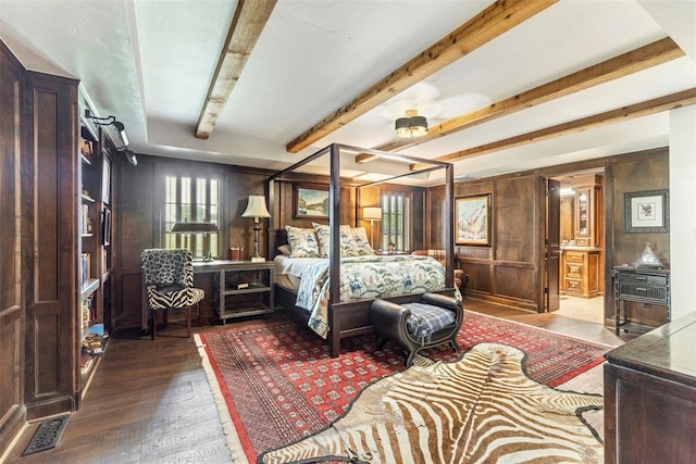 bedroom featuring hardwood / wood-style floors and wood walls