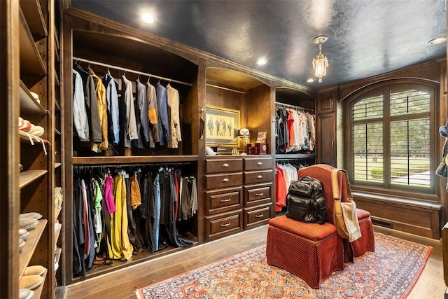 spacious closet with light hardwood / wood-style floors