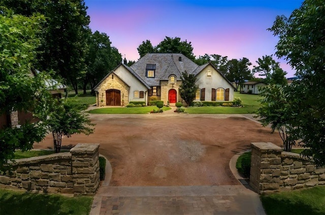 french provincial home with a yard