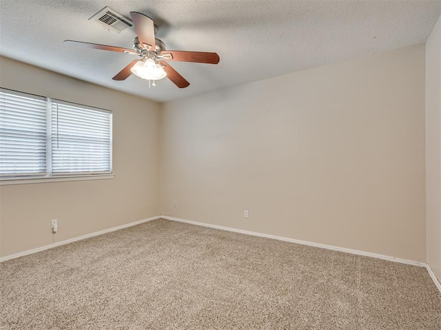 empty room featuring carpet floors and ceiling fan