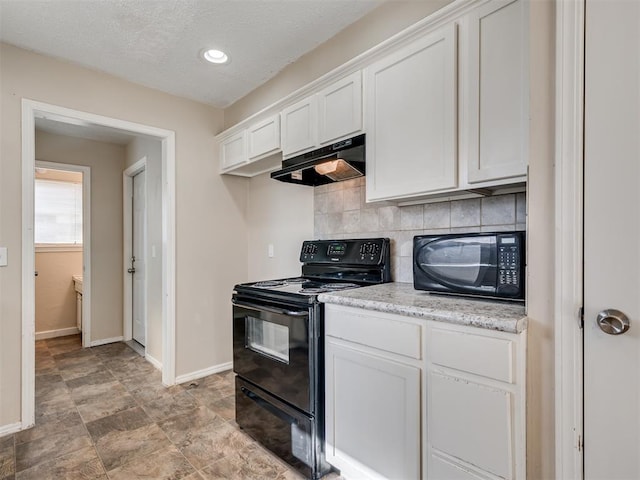 kitchen featuring white cabinetry, light stone countertops, tasteful backsplash, and black appliances