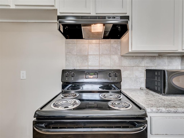 kitchen featuring white cabinetry, black appliances, and range hood