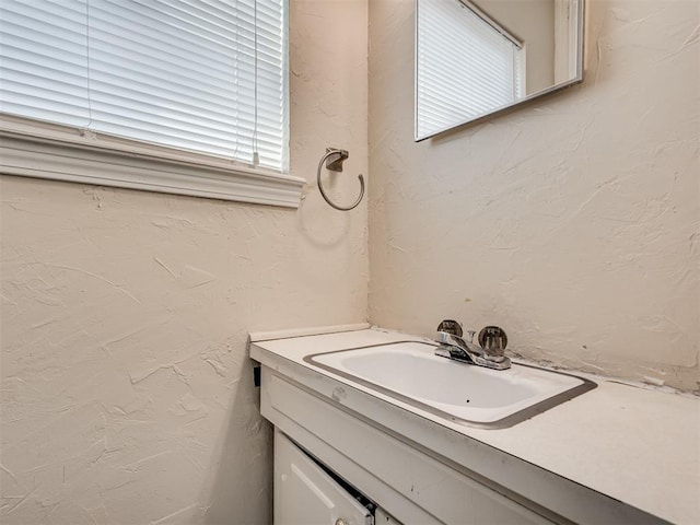 bathroom featuring vanity and a healthy amount of sunlight