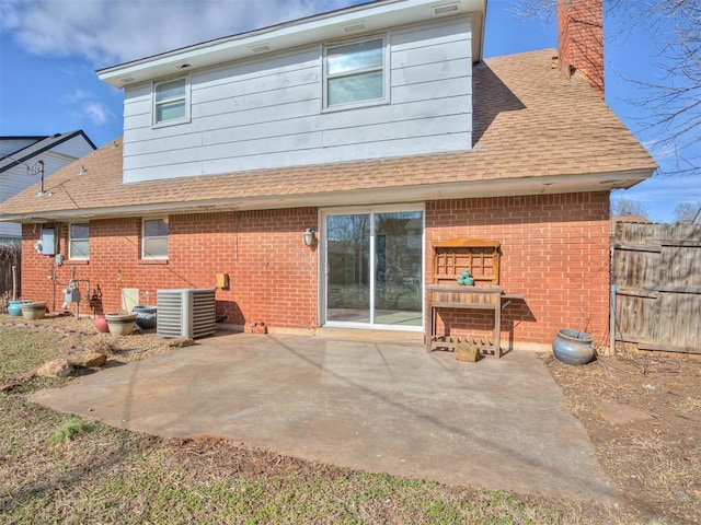 back of property featuring central AC and a patio area