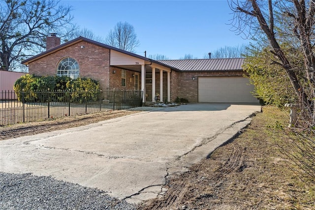 ranch-style home featuring a garage