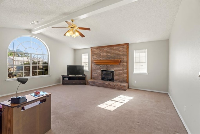 living room with ceiling fan, vaulted ceiling with beams, light colored carpet, and a textured ceiling