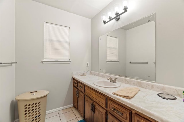 bathroom featuring tile patterned flooring and vanity