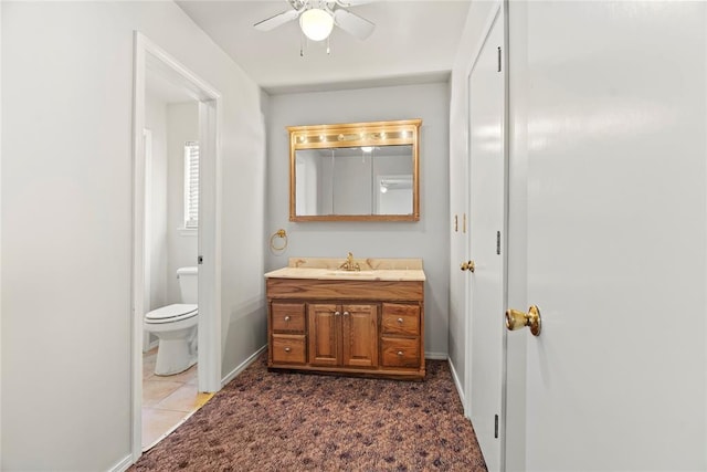 bathroom with vanity, ceiling fan, and toilet