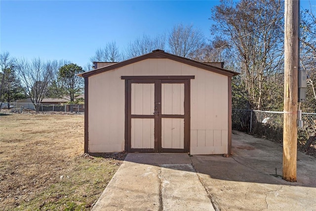 view of outdoor structure with a lawn