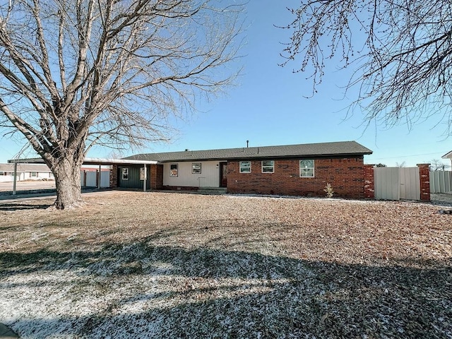 rear view of house featuring a carport