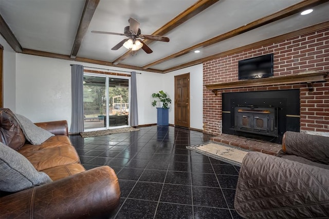 living room featuring ceiling fan, a wood stove, and beam ceiling