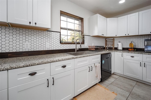 kitchen with sink, white cabinets, and black dishwasher