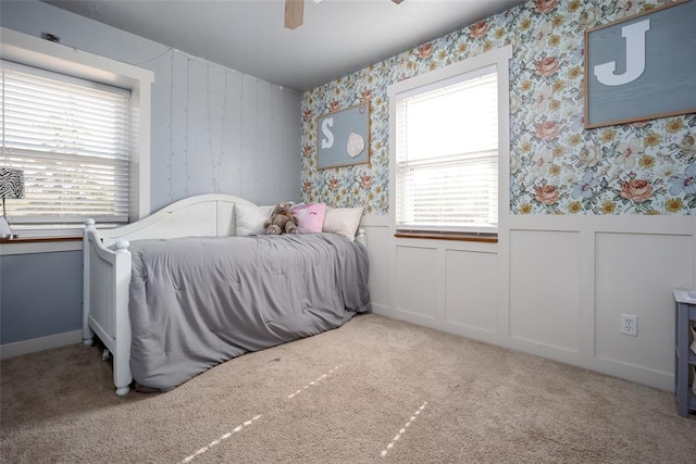 carpeted bedroom with ceiling fan