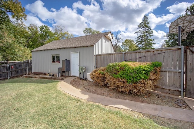 view of outbuilding with a lawn