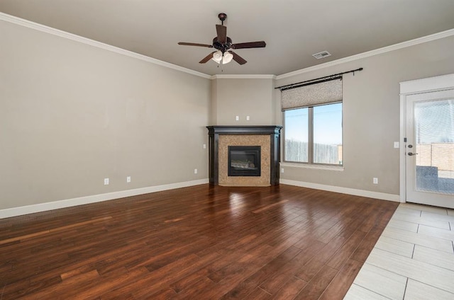 unfurnished living room with crown molding, ceiling fan, and wood-type flooring