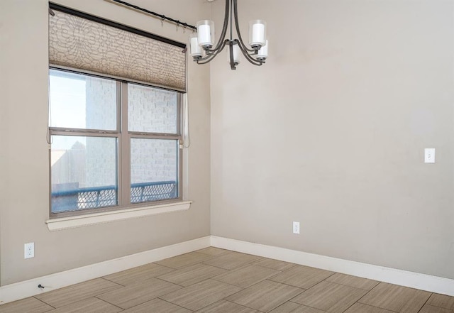 unfurnished dining area featuring an inviting chandelier