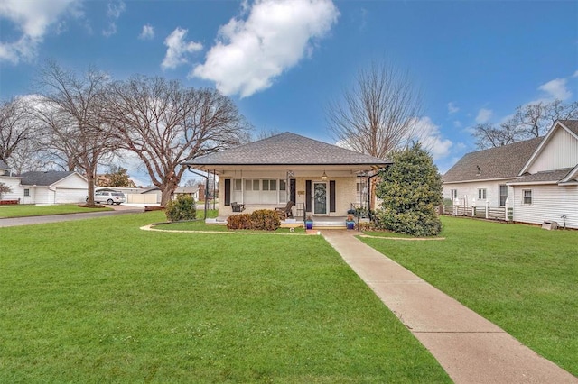 view of front facade featuring a front lawn and covered porch