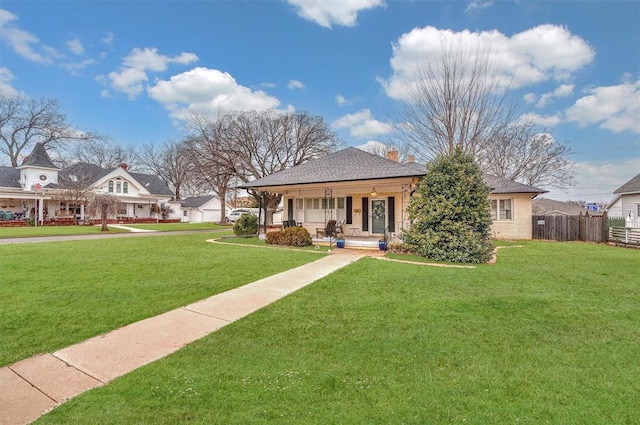 view of front of house with a front lawn and covered porch