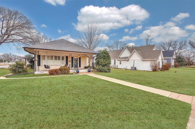 ranch-style home with a front lawn and covered porch