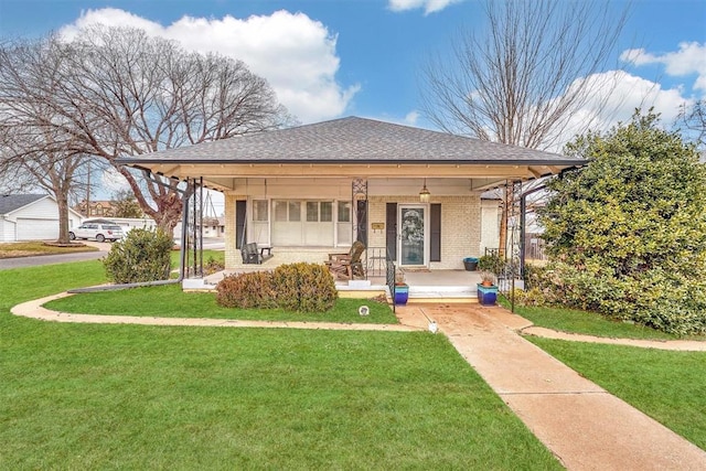 view of front of home featuring covered porch and a front lawn